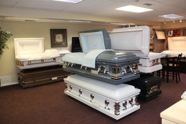 Several coffins are stacked on top of each other in a room.