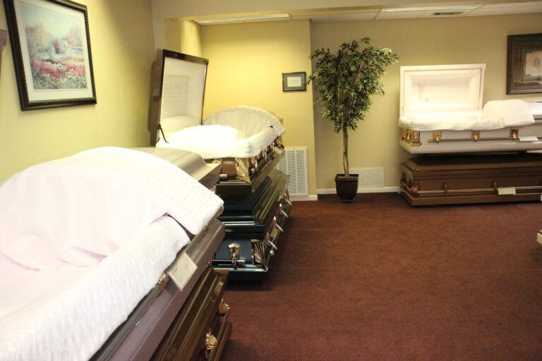 A room filled with coffins and a picture on the wall