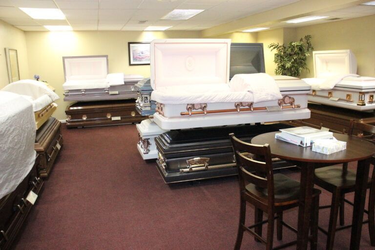 A room filled with lots of coffins and a table