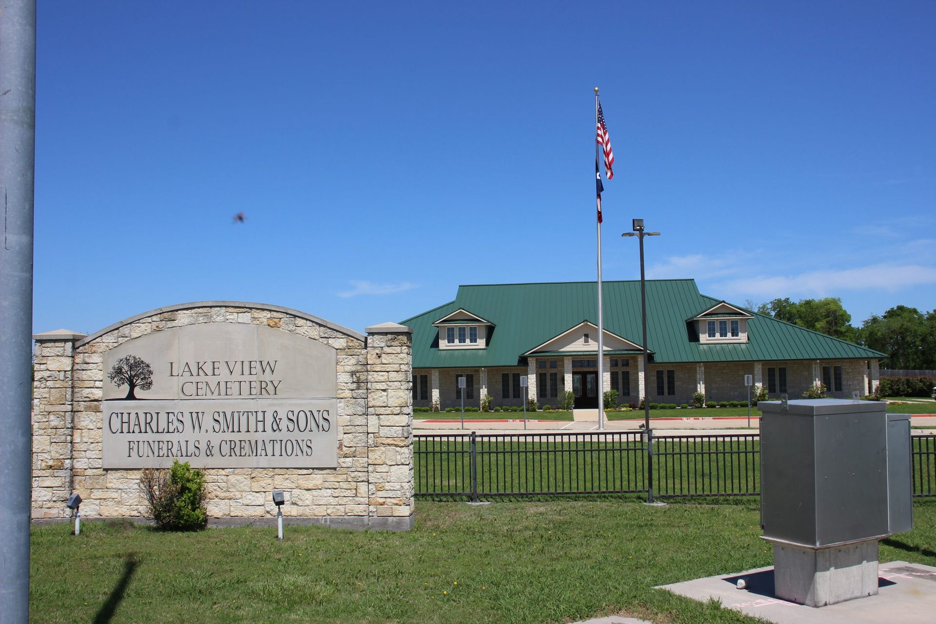 A building with a green roof and a sign that says lakeview