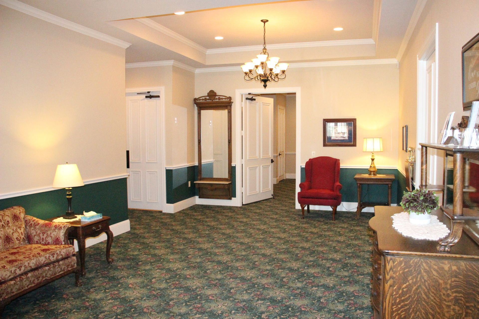 A living room with a couch and chairs in it