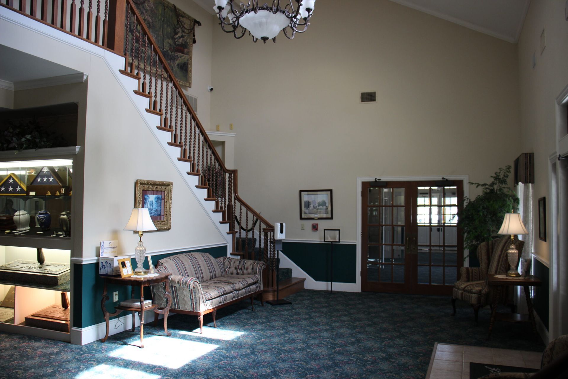 A living room with a staircase and a couch