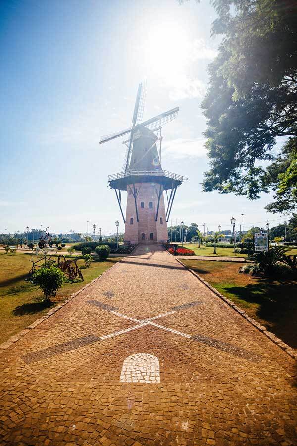 A windmill at the end of a road