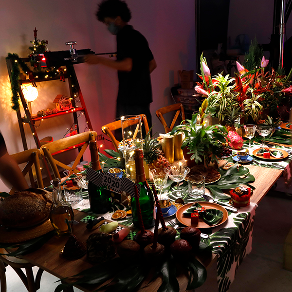 A crew member ajusts elements from the set decoration