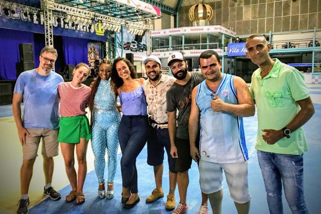 A group of people are posing for a picture in a stadium.