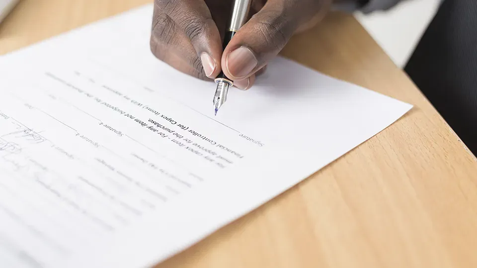 Person signing a contract