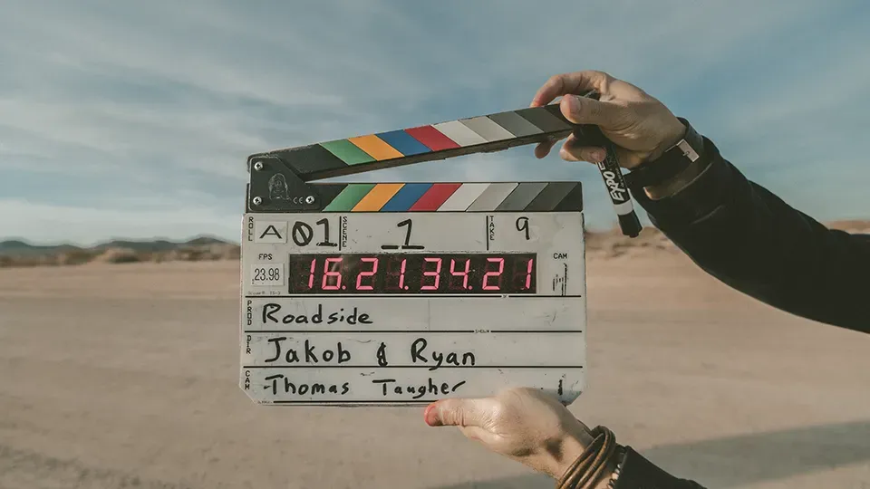 Person holding a clapperboard