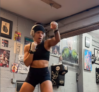 Photo of trainer Hillary Rodriquez shadow boxing.