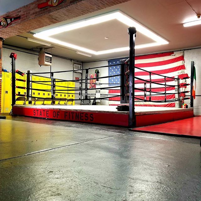 A boxing ring that says state of fitness on it