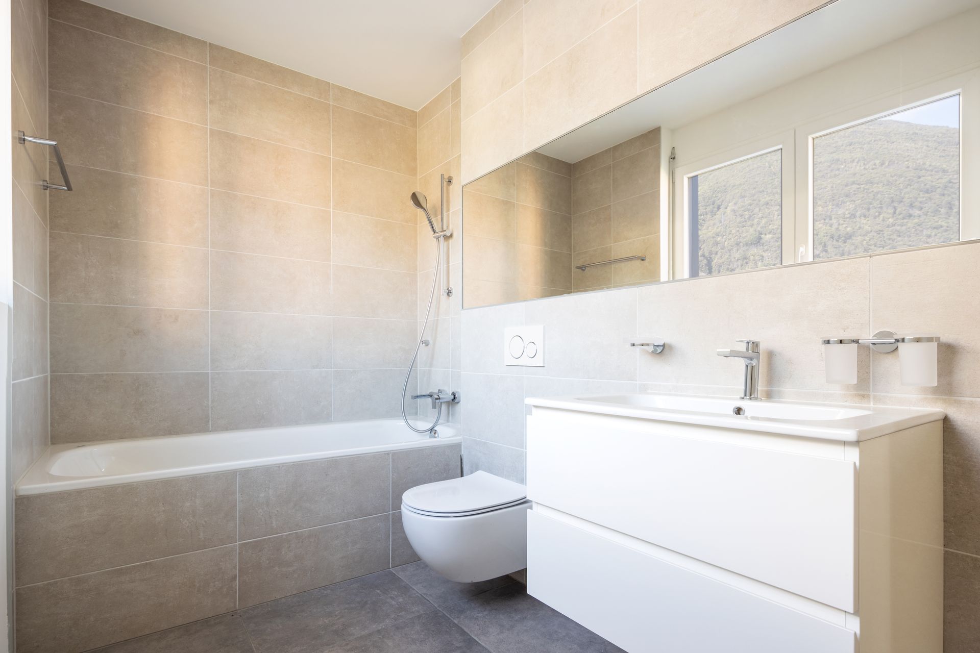 Modern white bathroom with bathtub, walk-in shower, sink vanity, and mirror cabinets