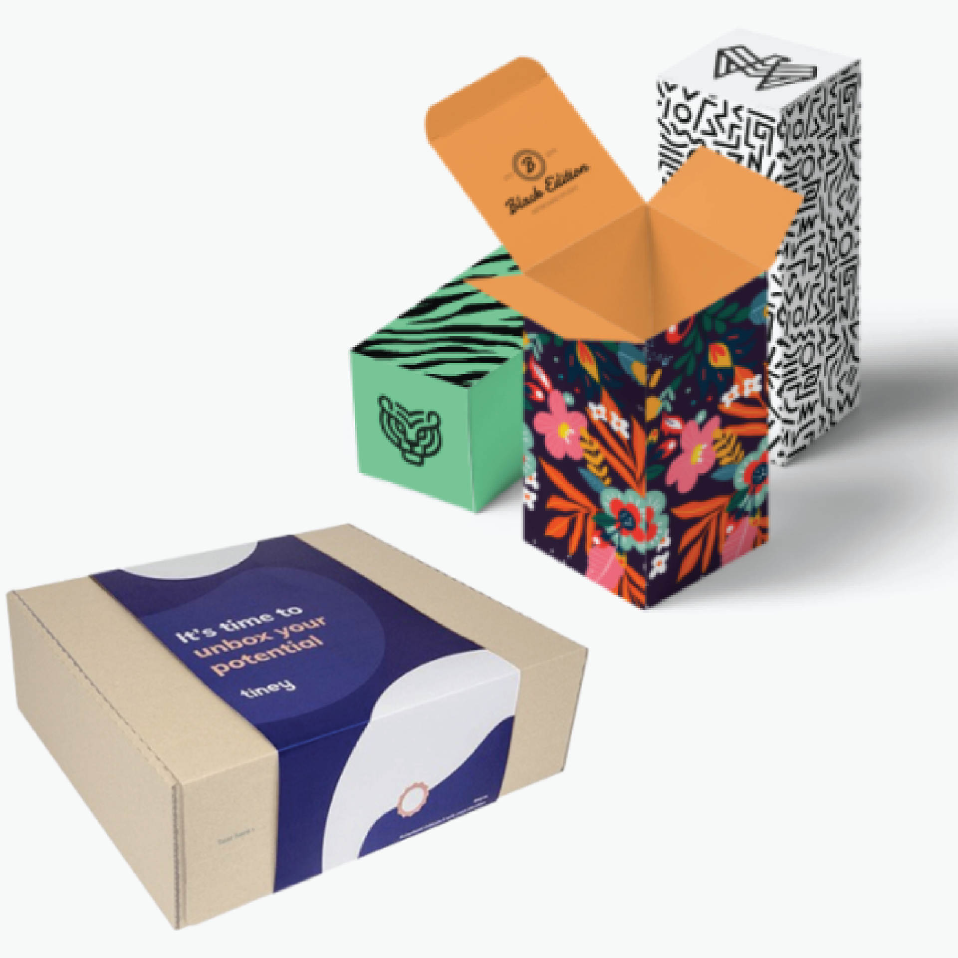 Three boxes with different designs on them are stacked on top of each other.