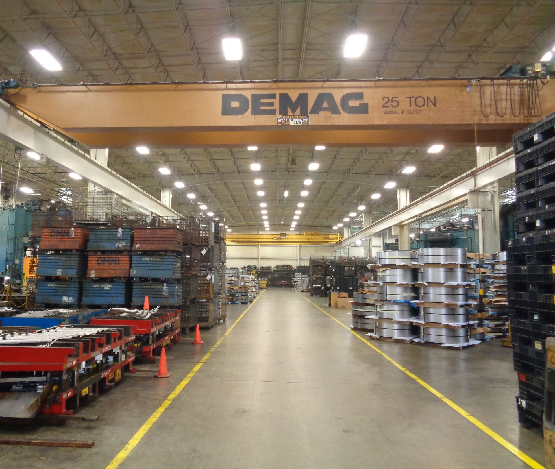A large warehouse with a demag overhead crane