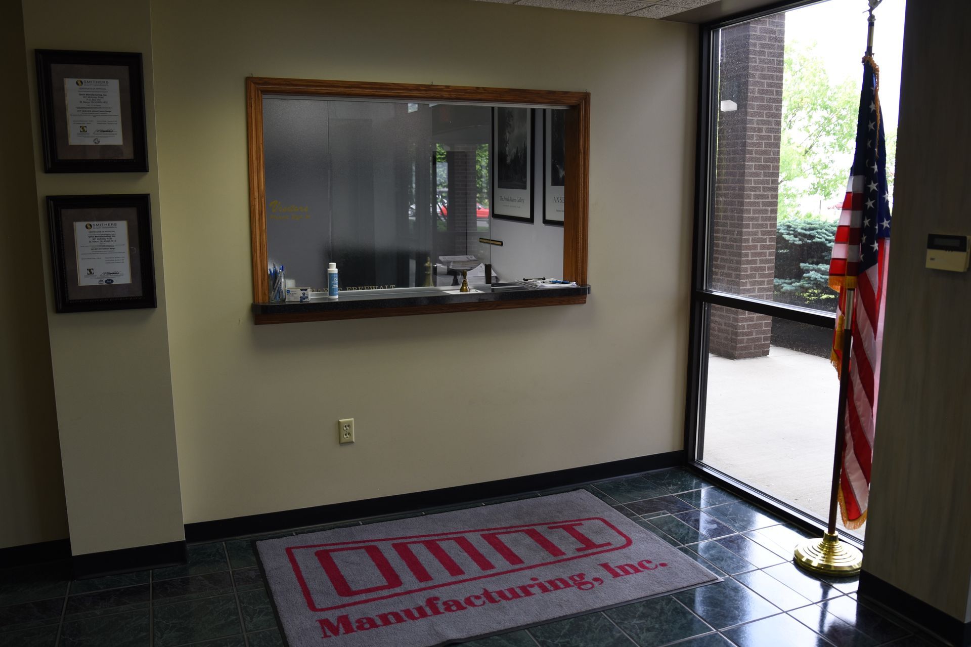 A room with a sign that says dmm manufacturing inc.