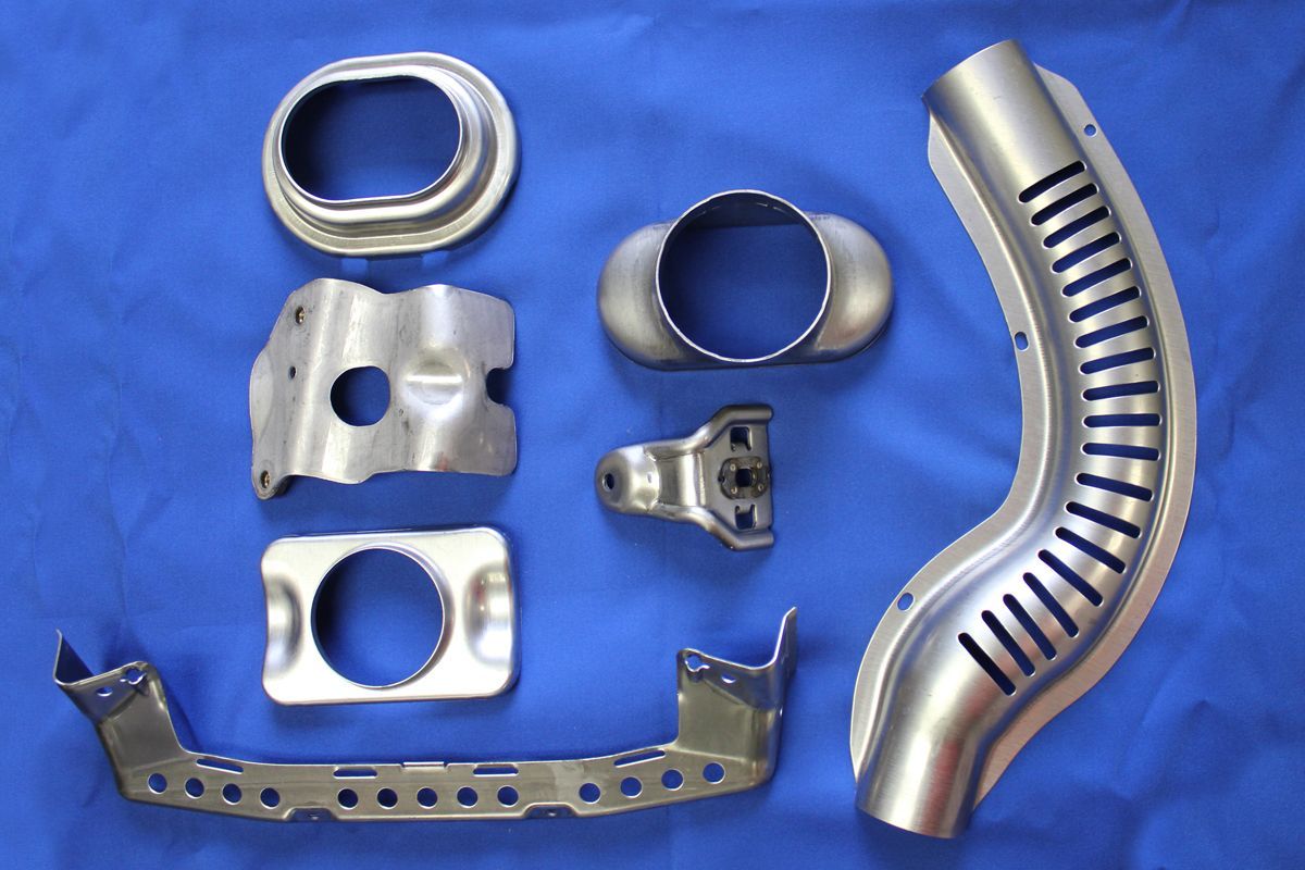 A bunch of metal parts on a blue cloth