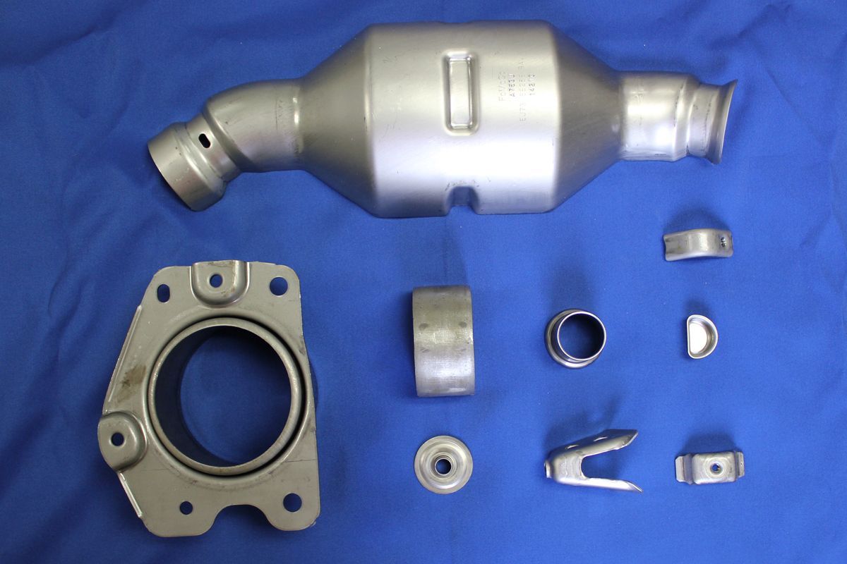 A bunch of metal parts on a blue cloth