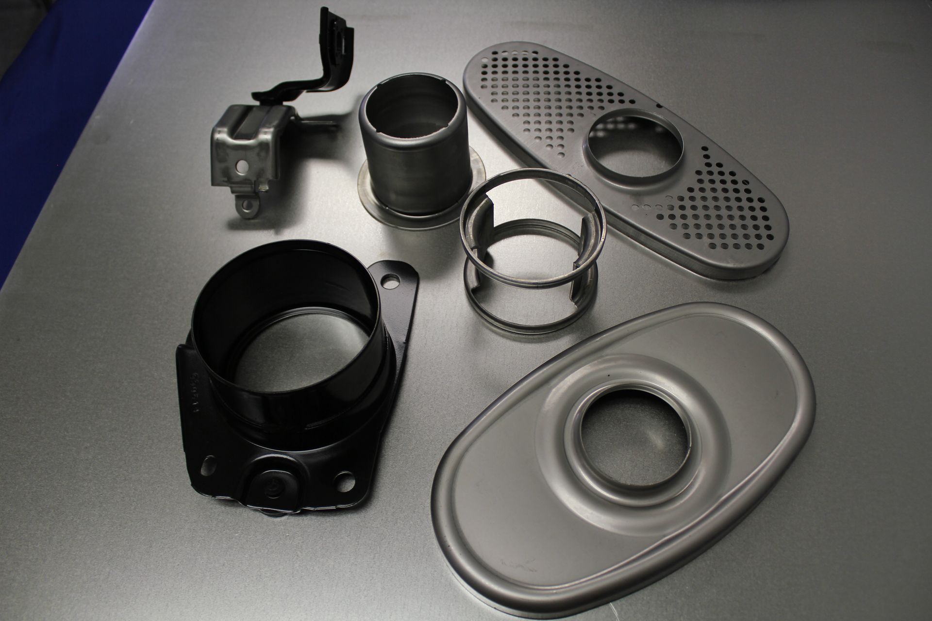 A bunch of metal parts are sitting on a table