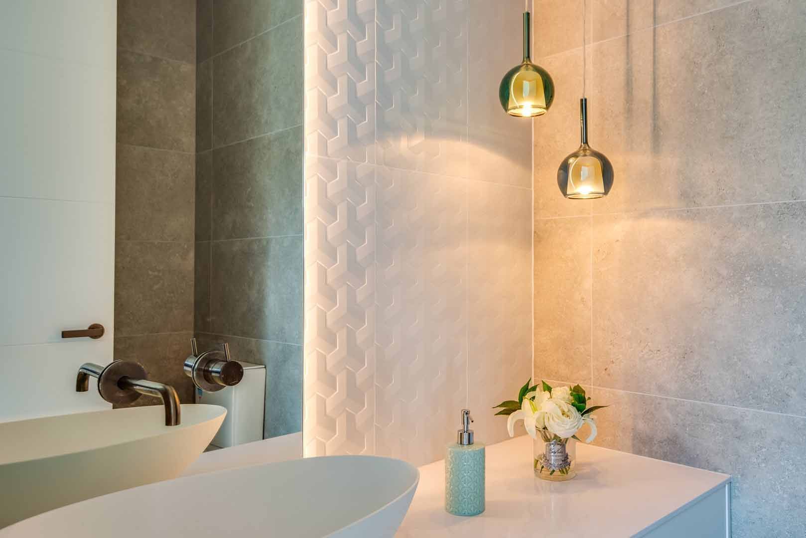 A bathroom with a sink and a mirror.