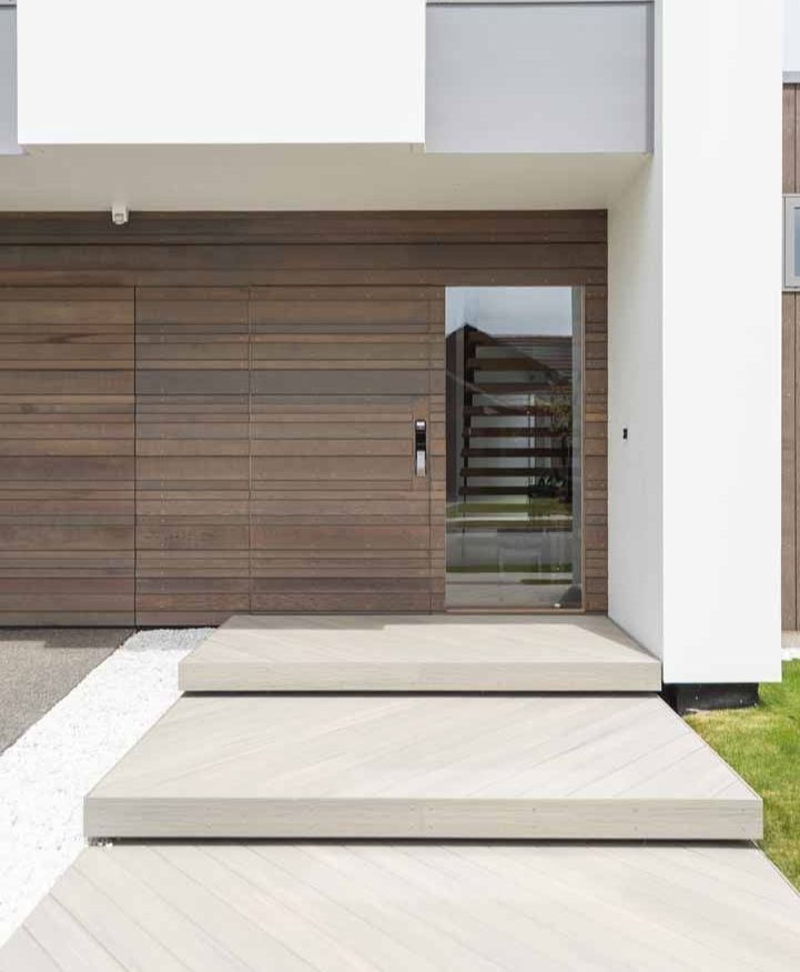 A modern house with a wooden garage door