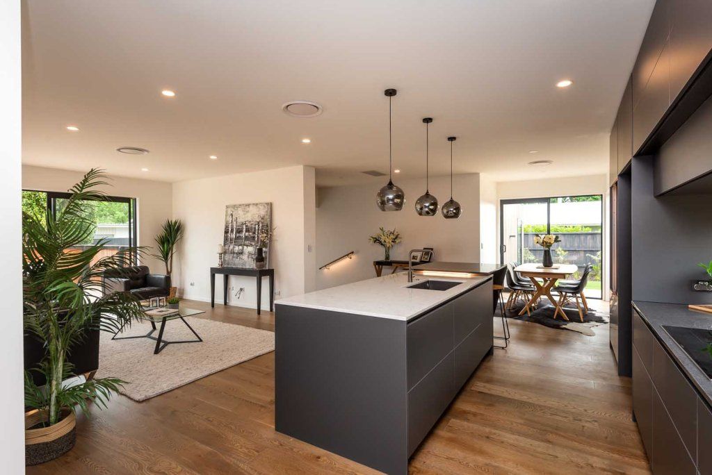 A kitchen with a large island in the middle of the room.