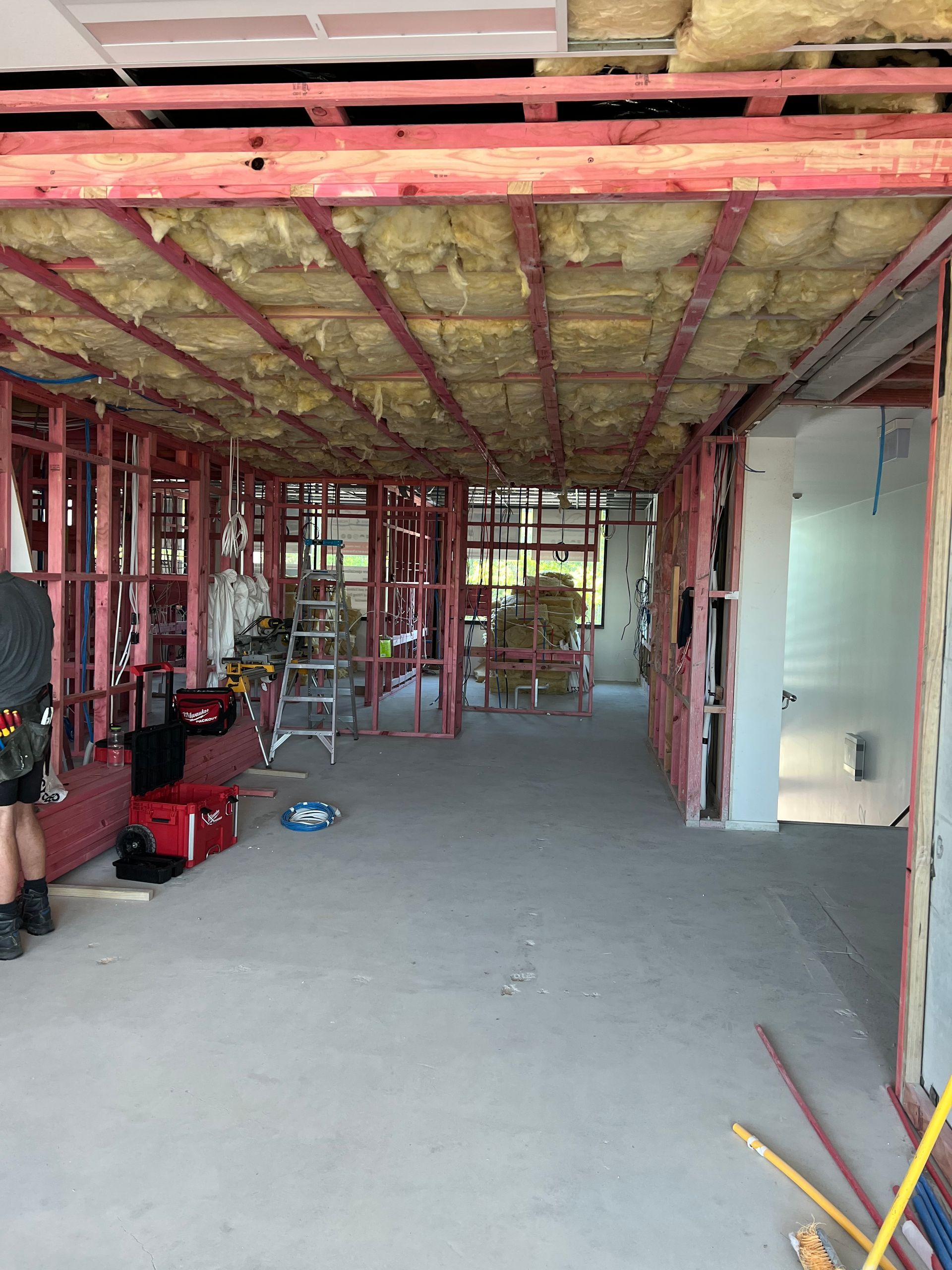 A building under construction with a lot of insulation on the ceiling.