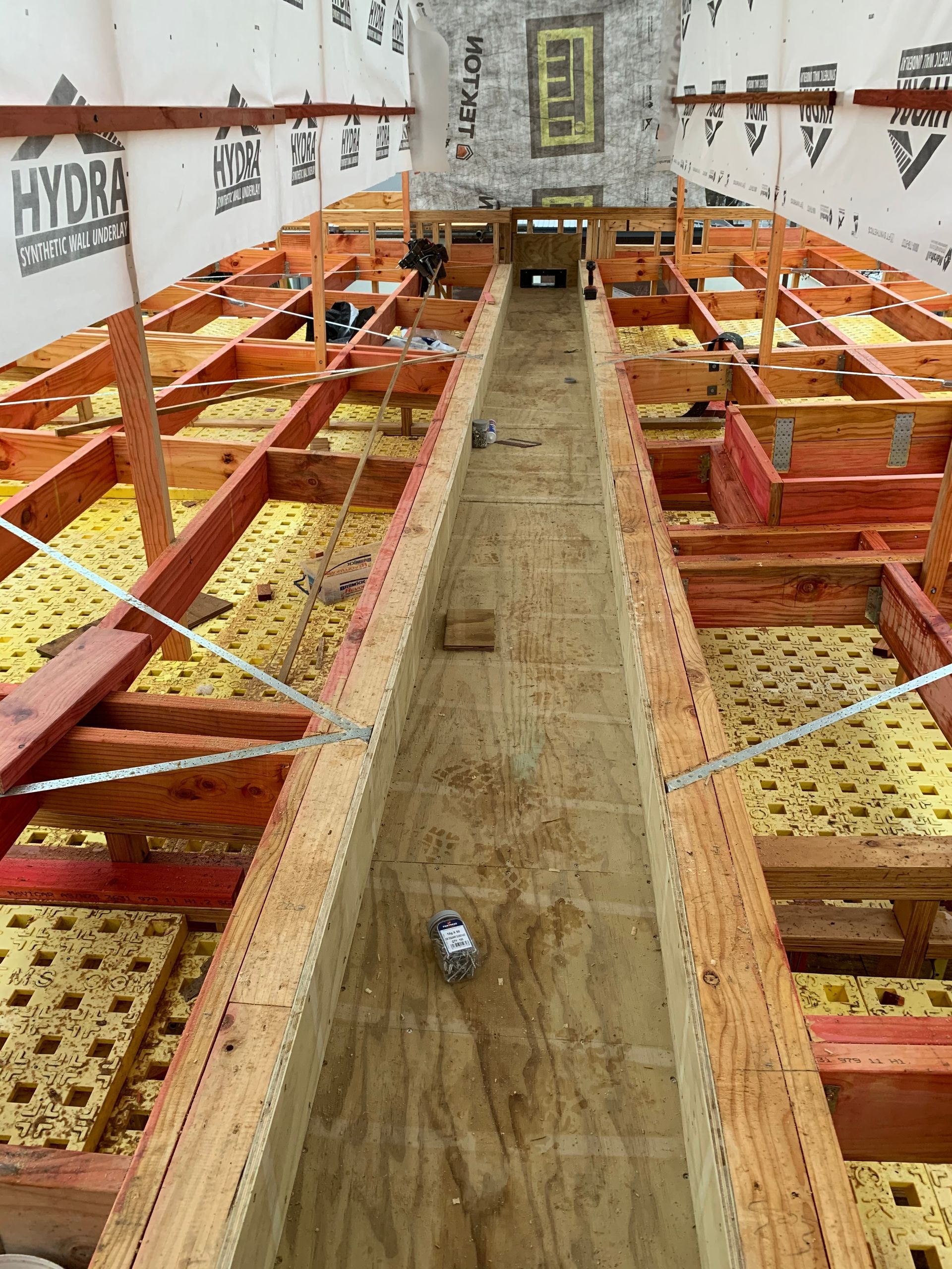 A boat is being built with a lot of wood and foam.