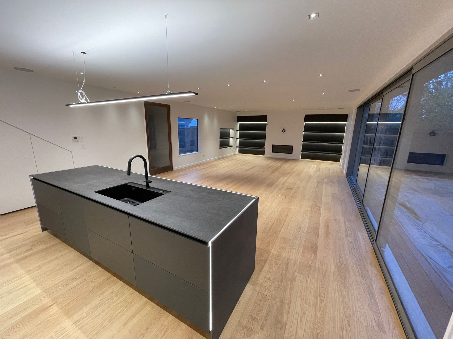 A kitchen with a large island and a sink