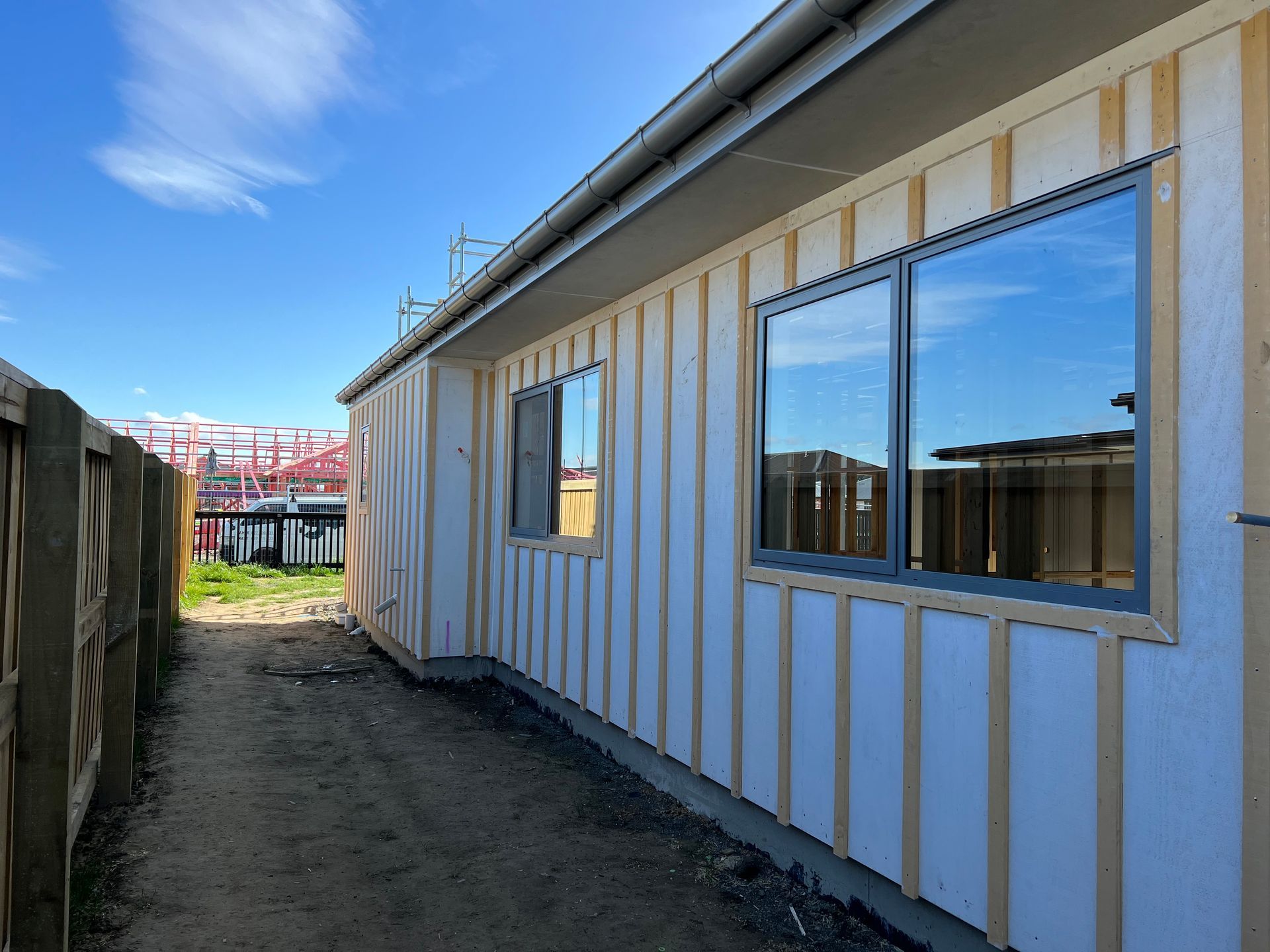 A house is being built with a lot of windows.