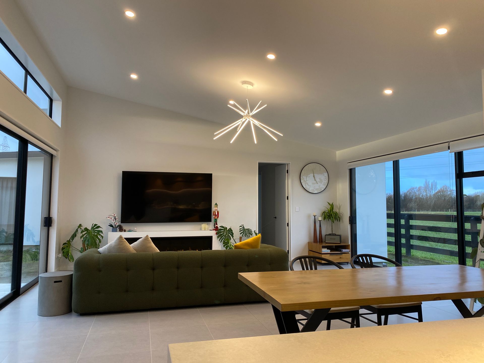 A living room with a couch , table , and television.