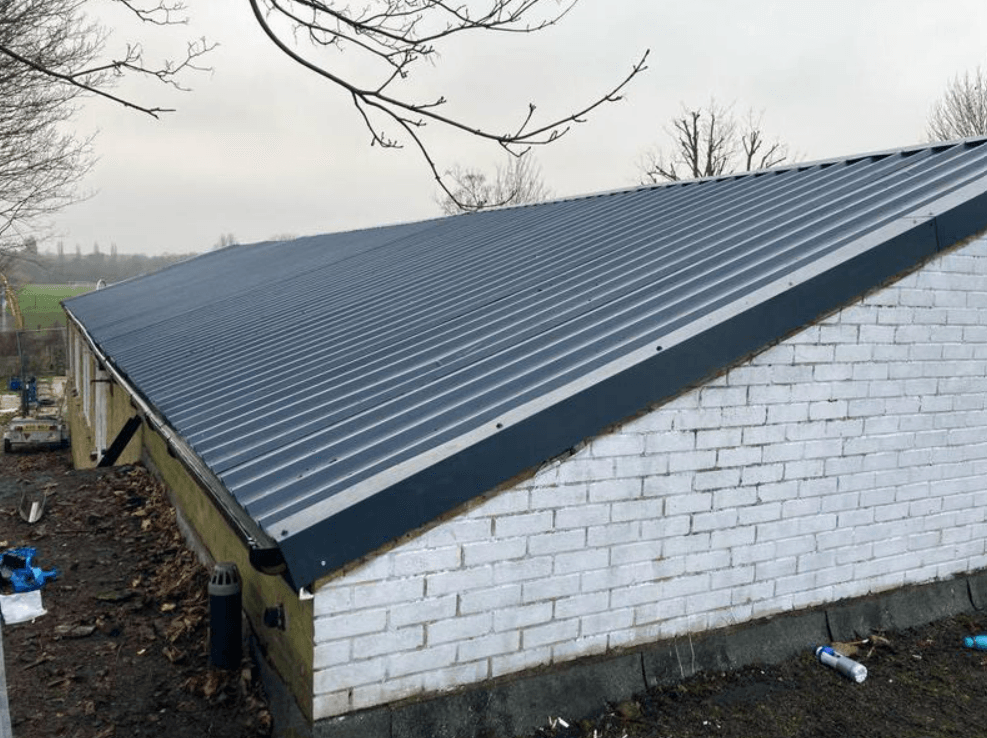 Picture of a new commercial metal sheet factory roof by Roofers Nottingham