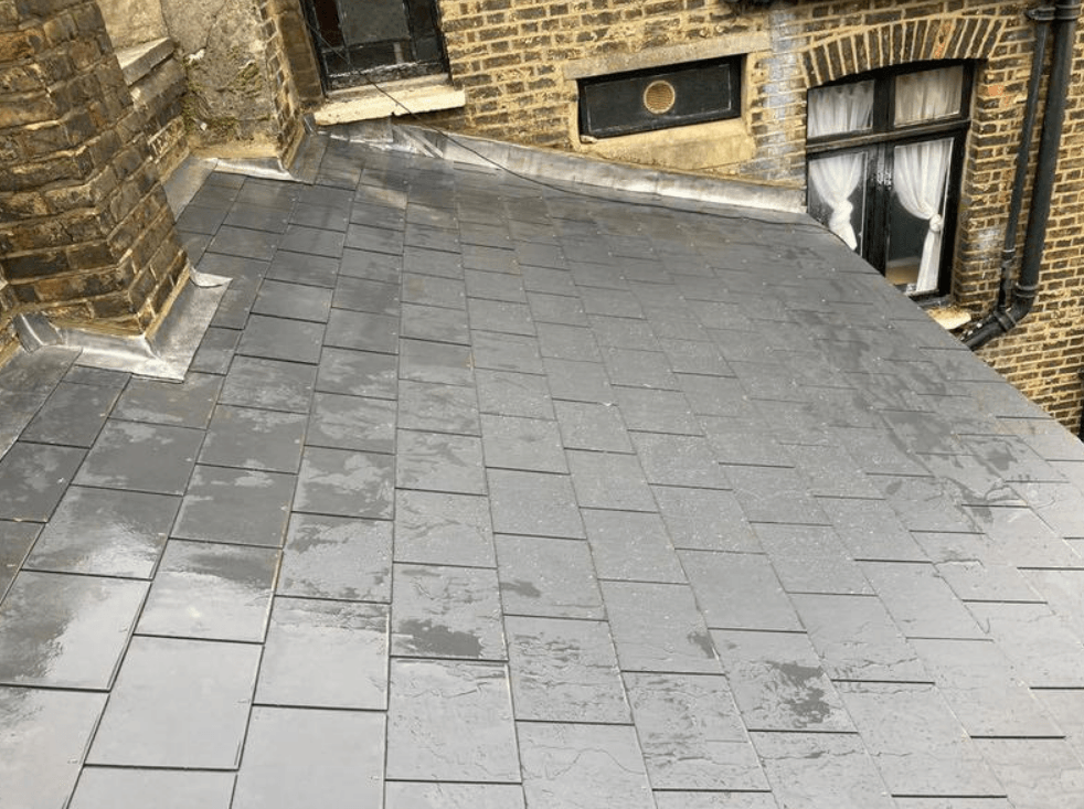Picture of a synthetic slate roof tile on a cottage roof  by roofers Nottingham