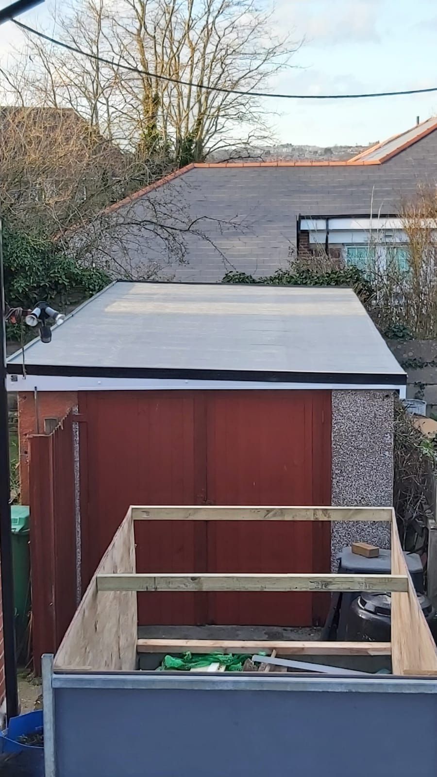 A picture of a flat roof replacement on a garage roof by JTB Roofers Nottingham