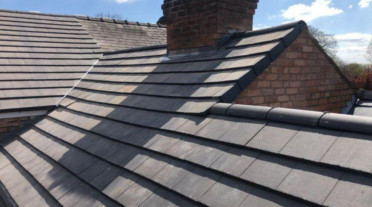 Picture of a new dark grey concrete tile roof by Roofers Nottingham
