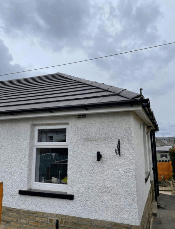Picture of a new grey slate effect tile roof replacement on a detached bungalow  property by Roofers Nottingham