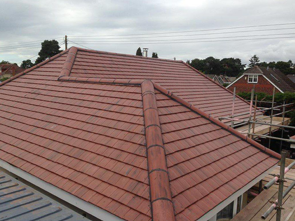 Picture of a new detached roof in duo edgemere dark English red clay tile