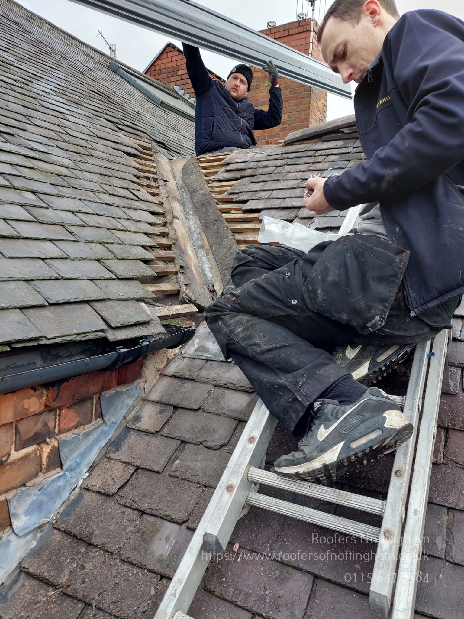 a picture of roofers Nottingham carrying out a valley repair on a pitched roof