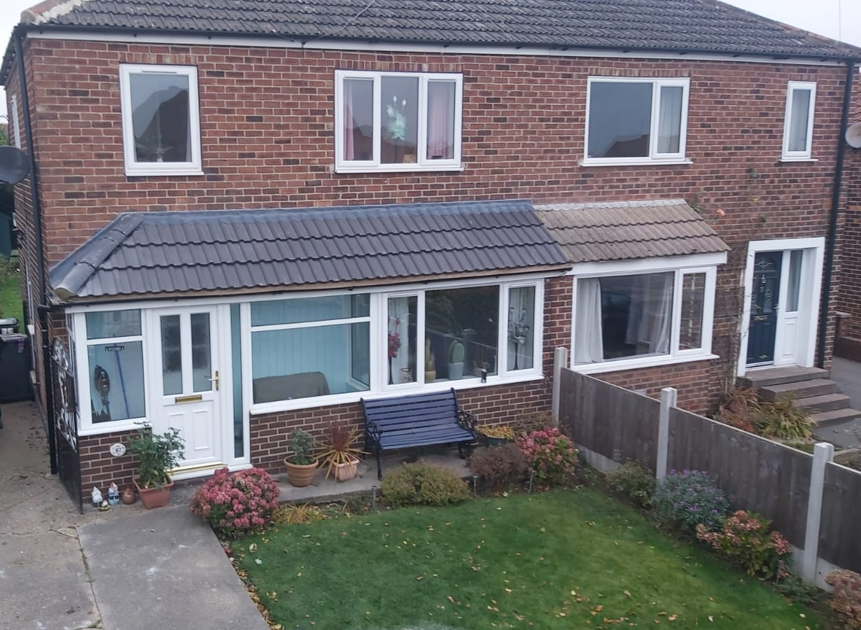 Picture of a new main roof and porch roof replacement in grey concrete tile by Roofers Nottingham