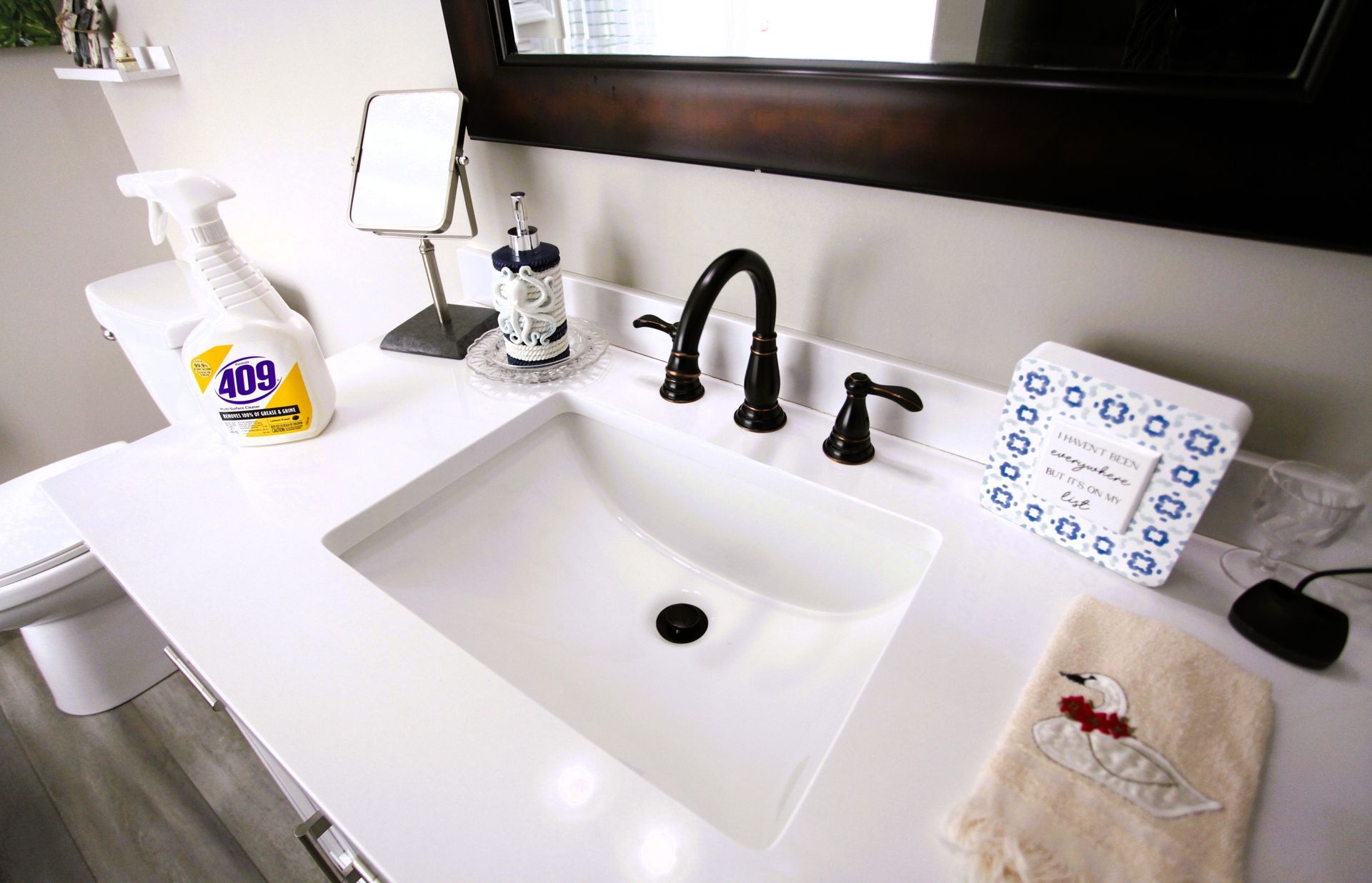 Shining sterilized clean bathroom sink and bronze faucet.