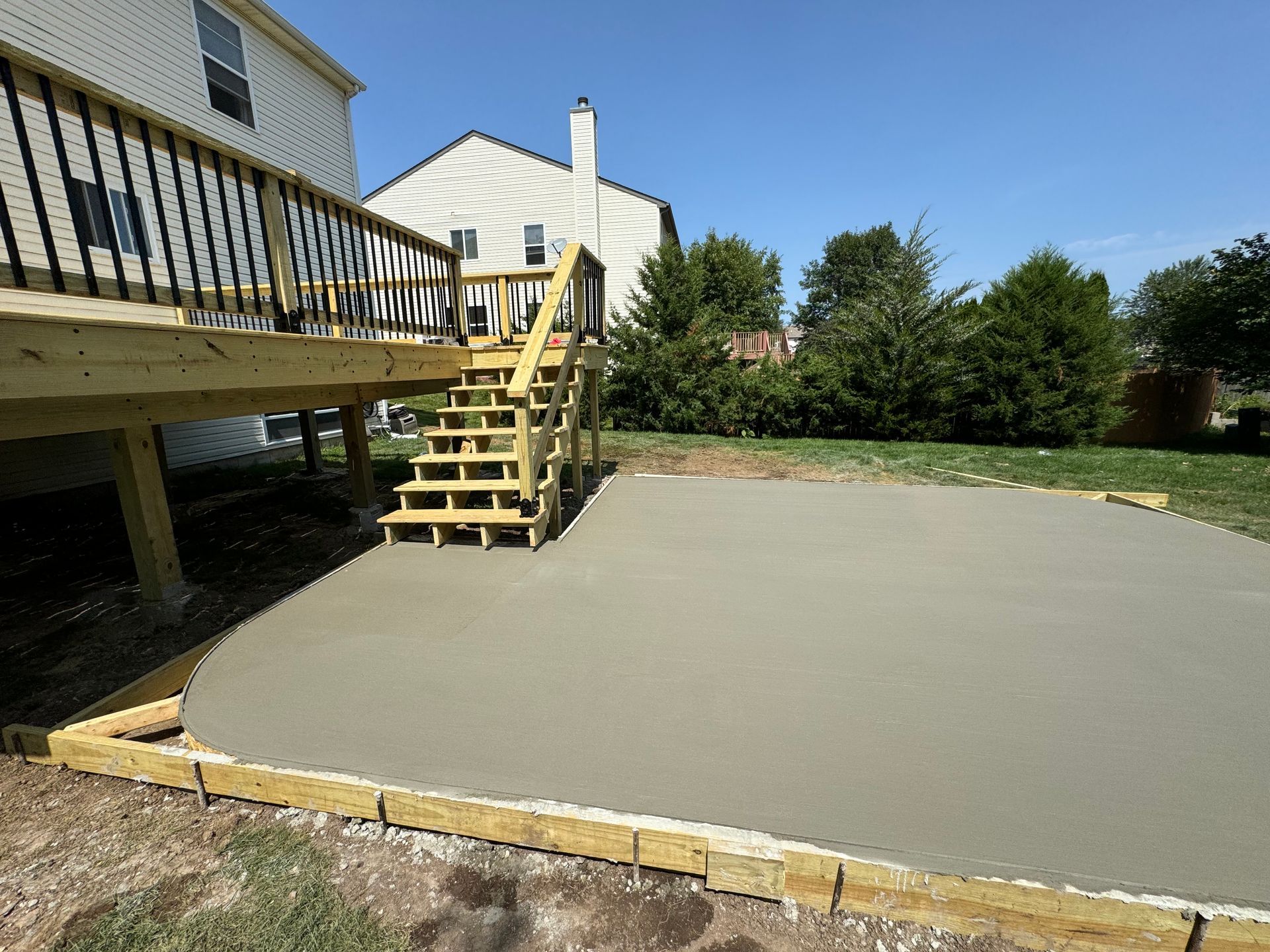 A group of people are working on a sidewalk.