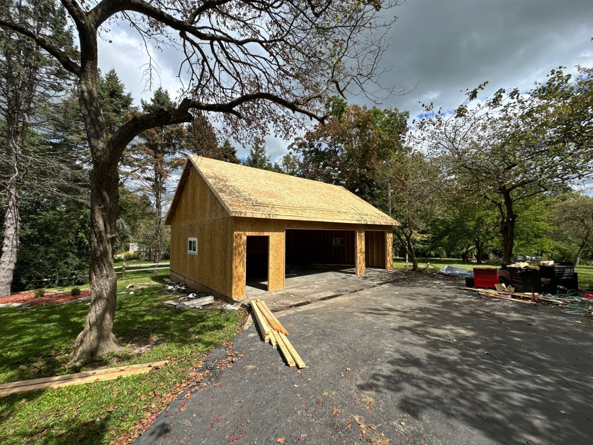 The inside of a house under construction with a lot of wood.