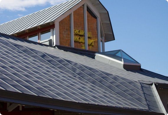 A roof of a building with a sign that says ' acorn ' on it