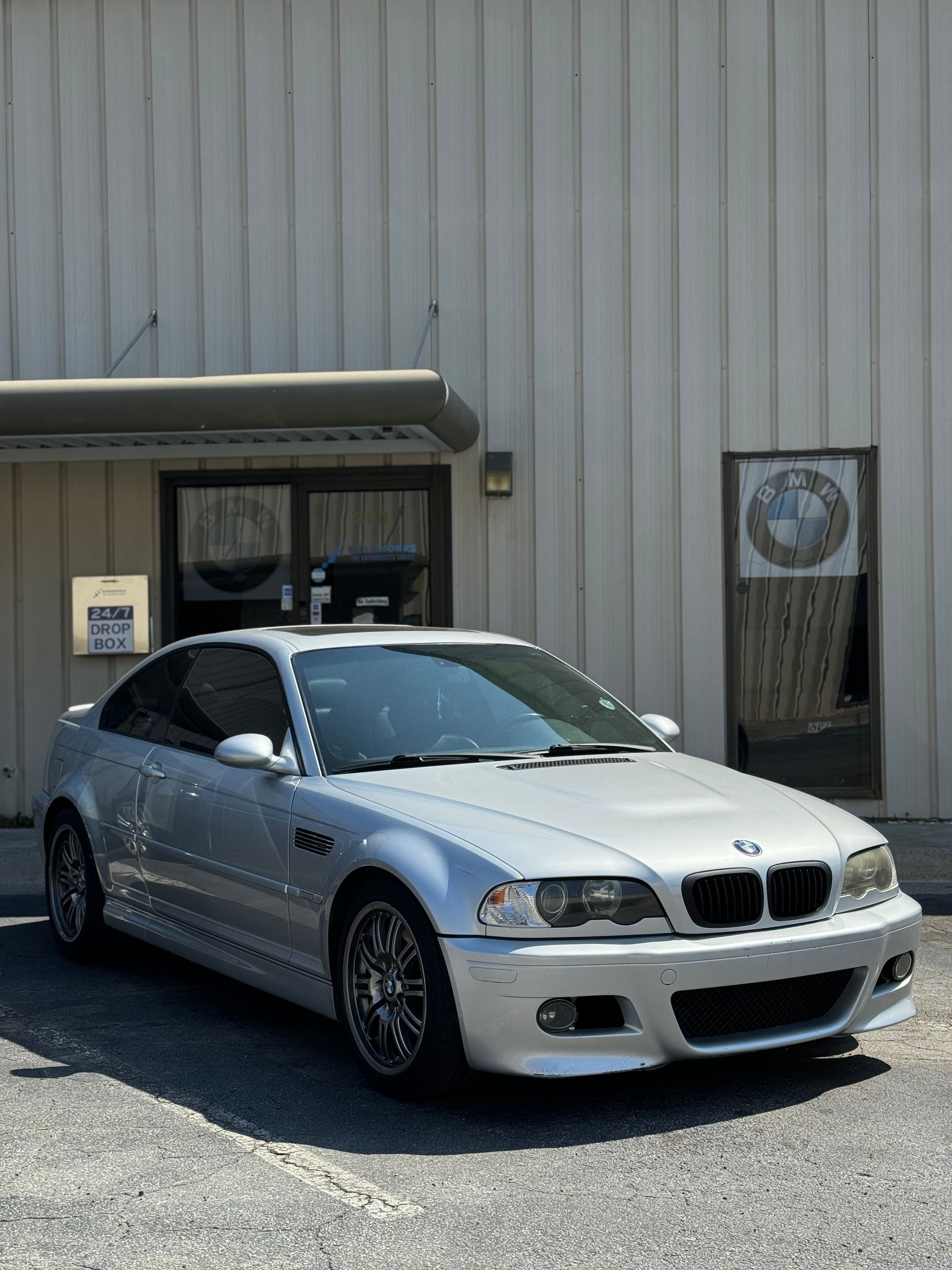 White Car Outside the Garage | EuroWorks