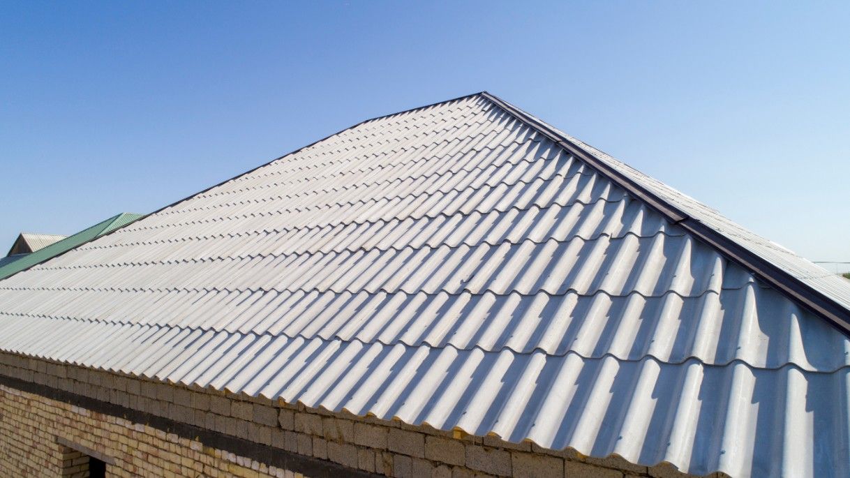 A Close Up of a White Roof With a Blue Sky in the Background — Roofpoint In Kawungan, QLD