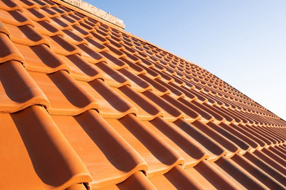 A Close Up of a Tiled Roof With a Blue Sky in the Background — Roofpoint In Kawungan, QLD