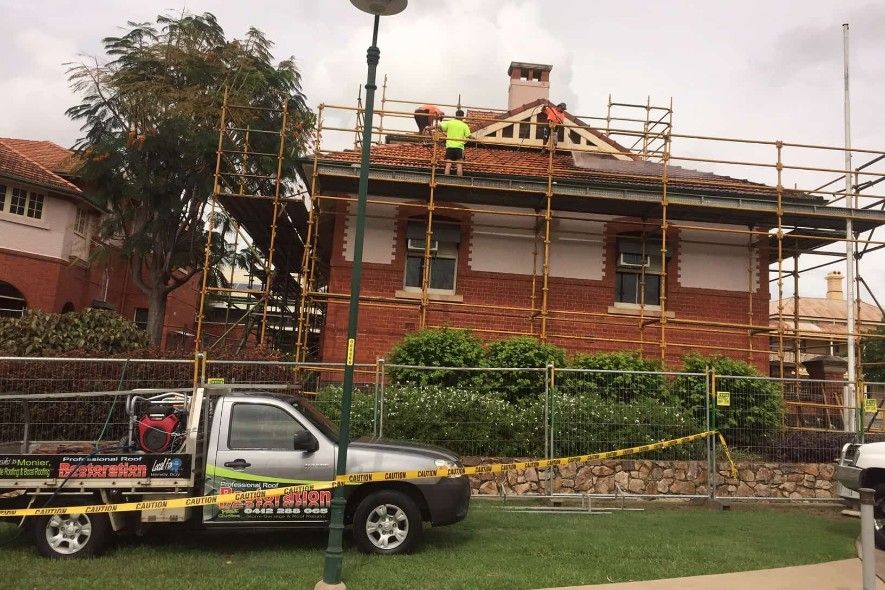 A Truck Is Parked In Front Of A Brick Building Under Construction — Roofpoint In Kawungan, QLD