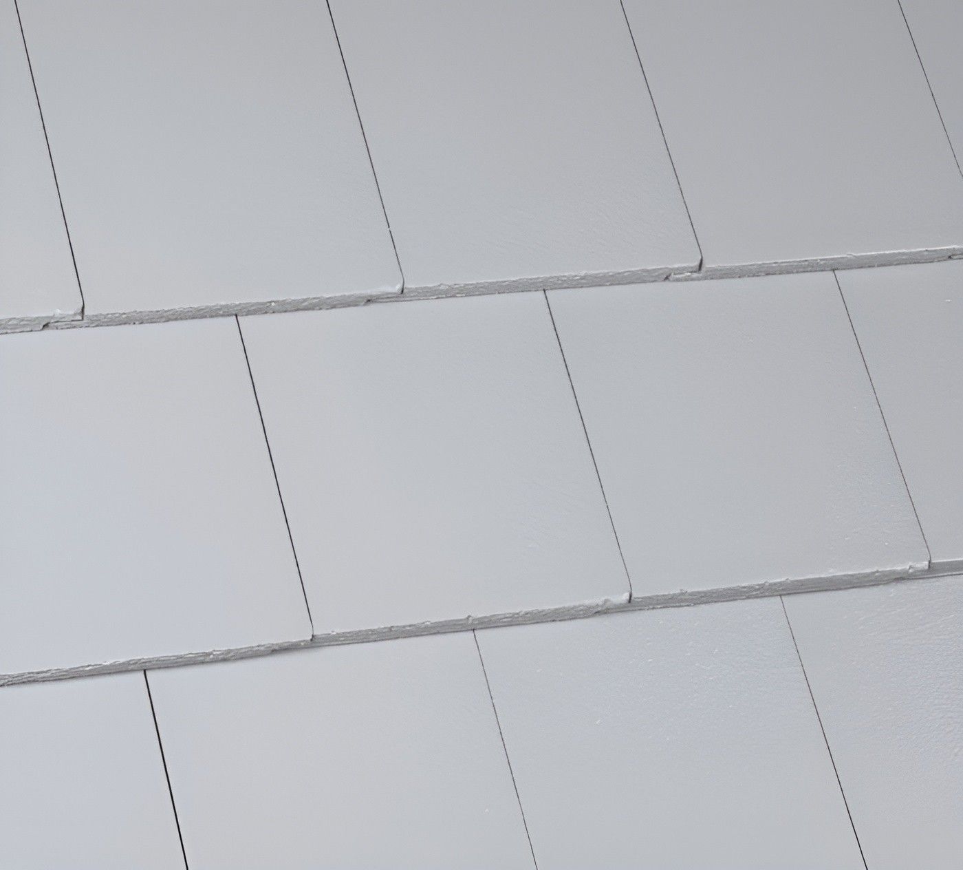 A Close Up of a White Tile Roof — Roofpoint In Kawungan, QLD