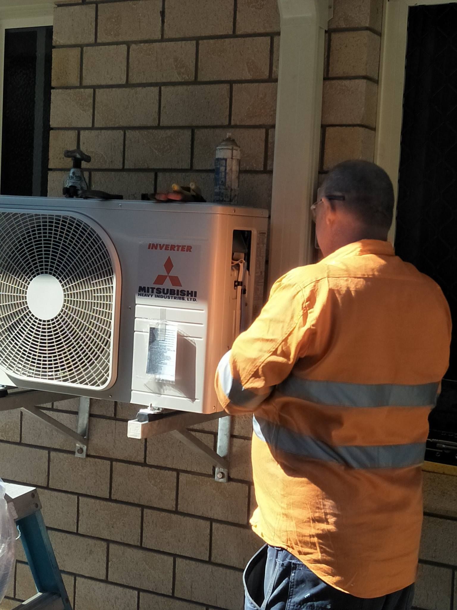 Repairing An Air Conditioner — Local Electricians in Mackay, QLD