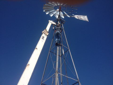 Repair Man on the Top of Windmill