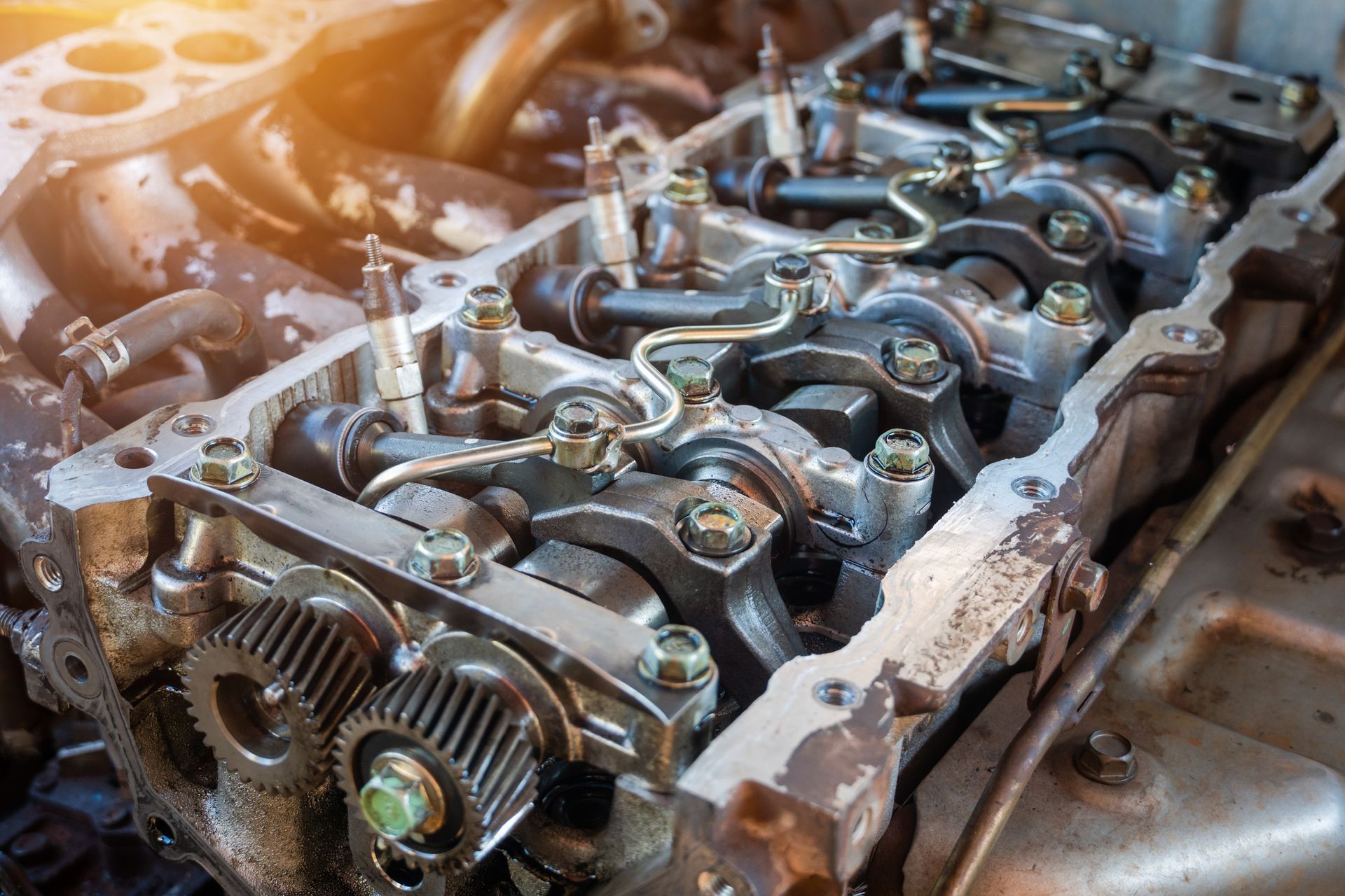 Close-up of disassembled engine components for professional transmission repair in auto repair shop
