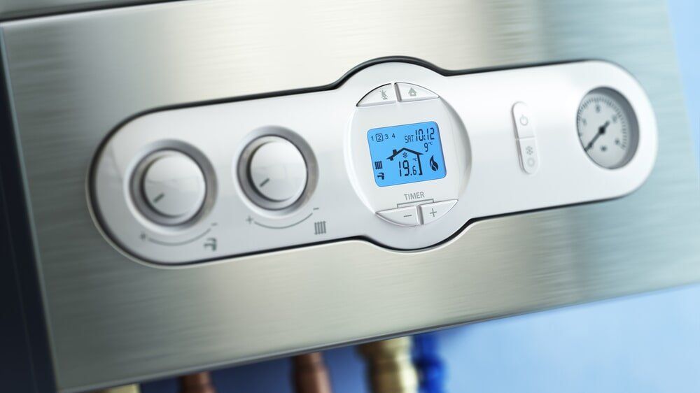 A close up of a boiler with a digital display on it.