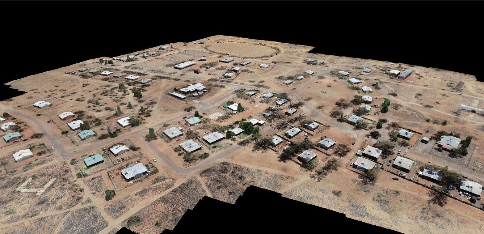 An aerial view of a residential area with lots of houses and trees.